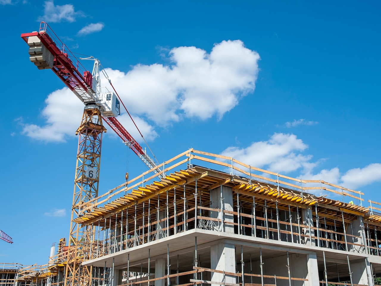 Apartment building under construction on a sunny day Apartment building under construction on a sunny day